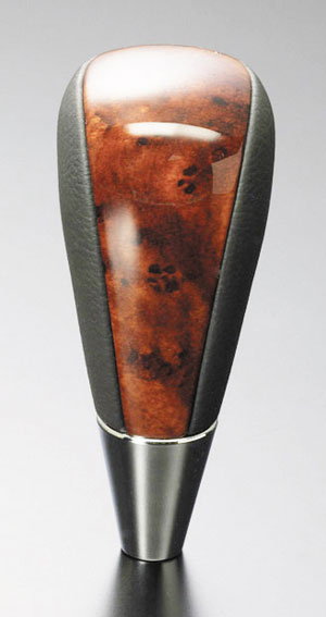 Quality leather-wood gear shift knob.