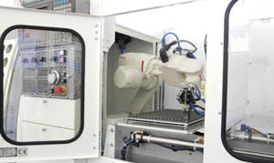 Quick-Tech supplies an advanced CNC lathe with attached robotic arm.