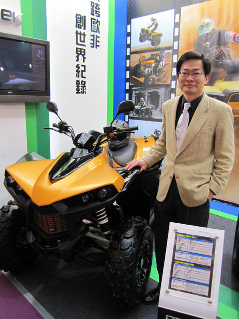CECTEK president Allan Yang stands beside his company`s Kingcobra sport ATV.