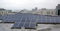 Arrays of solar panels installed on top of NSP headquarter building.