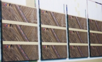 Anderson's computerized printing system finishes surfaces with lifelike wood grains. 