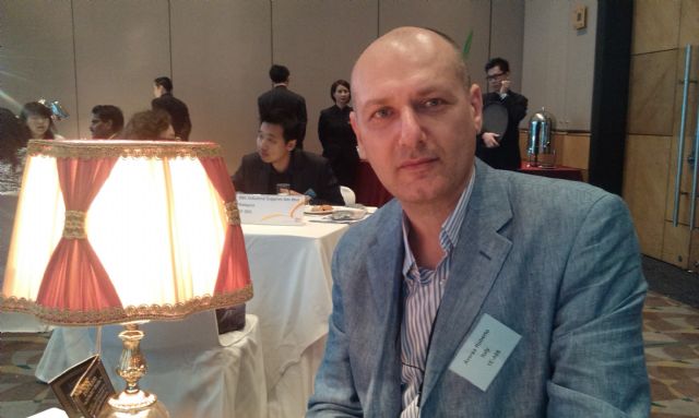 Roberto Aversa with Forme Di Luce Roma’s hand-made classical lighting fixture.