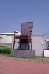 A giant chair greets visitors at the entry to the Tainan Furniture Museum.
