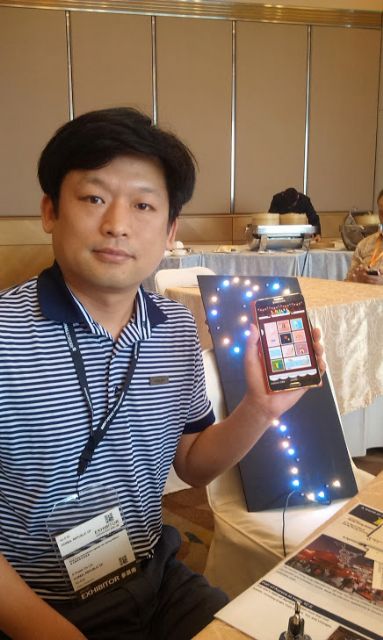 K Power Managing Director K.K. Lee and the smartphone-controlled Muse LED mood light. 