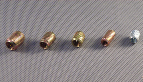 Embossed threaded inserts