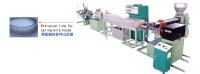 Extrusion line for spring-wire hoses